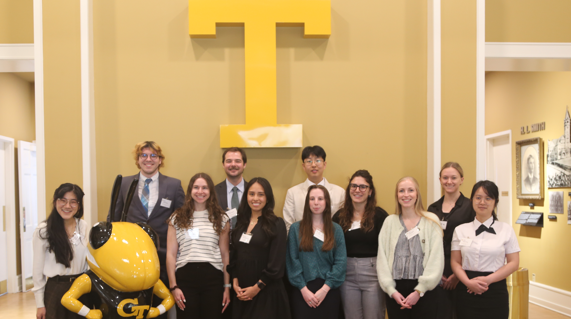 Students who receive the Georgia Power scholarships posed in front of the Big T with a statue of Buzz in Alumni Hall