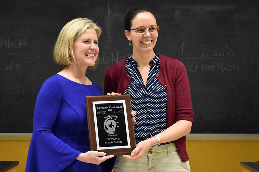 Jessica Kissel, right, accepts her first-place award in the Daniel W. Mead Paper competition. Kissel wrote about the importance of diversity in civil engineering. (Photo Courtesy: David Scott)