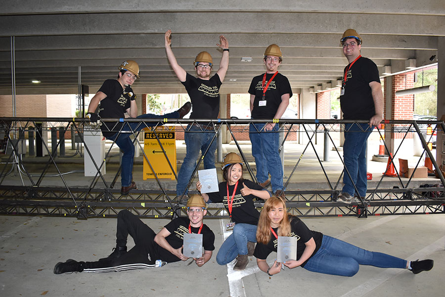 The 2019 steel bridge team poses atop their entry, which one first place in weight and aesthetics and third place overall at the ASCE Carolinas Regional Conference. (Photo Courtesy: David Scott)