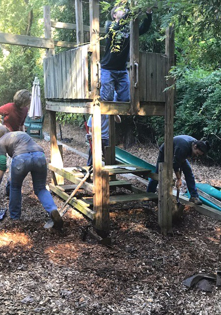 Students from the Georgia Tech chapter of the American Society of Civil Engineers prepare to take down a piece of playground equipment for International Women's House in Decatur, Georgia. (Photo Courtesy: ASCE Georgia Tech)