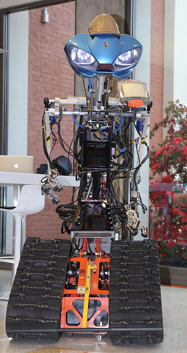 AWSM — "Awesome" or Autonomous Working Smart Machine — is what Dimitri Seneca Snowden calls the robot he built from scratch. Snowden donated the machine to Yong Cho's Robotics and Construction Automation Lab this spring. (Photo: Jess Hunt-Ralston)