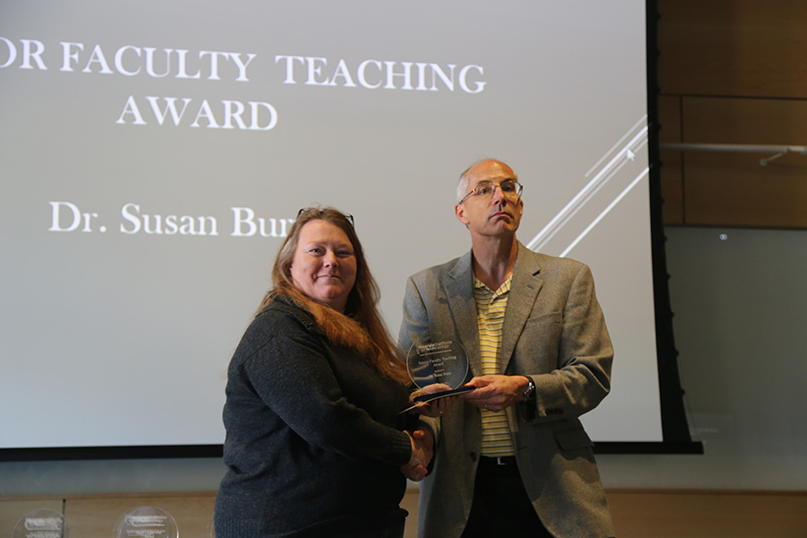Susan Burns receives her award from Ted Russell