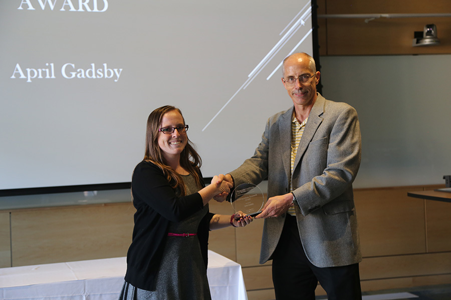 April Gadsby receives her award from Ted Russell
