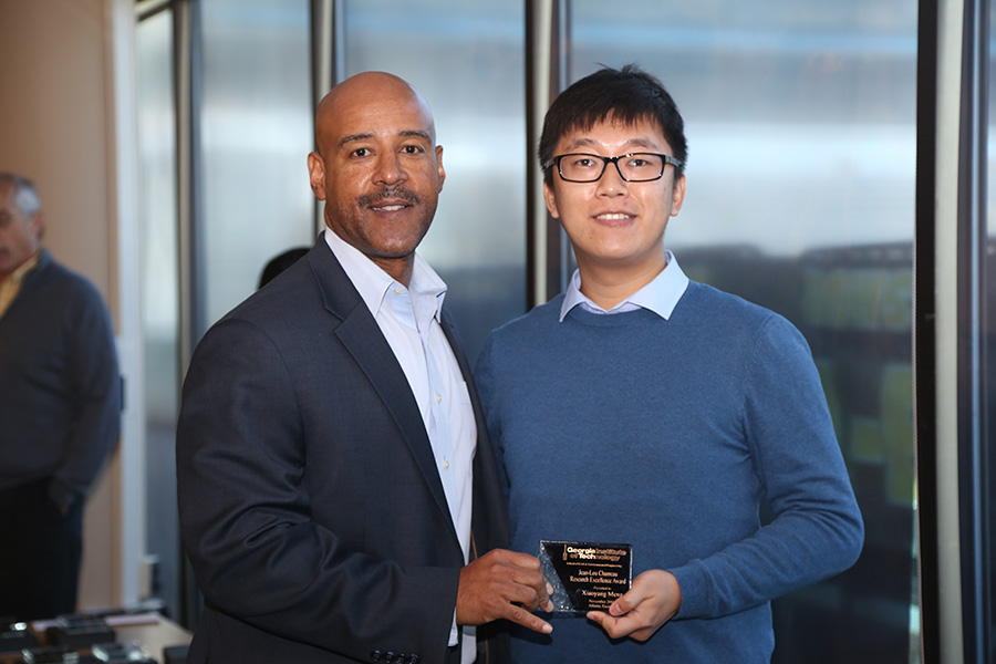 Xiaoyang Meng receives his award from School Chair Reginald DesRoches. (Photo: Jess Hunt-Ralston)