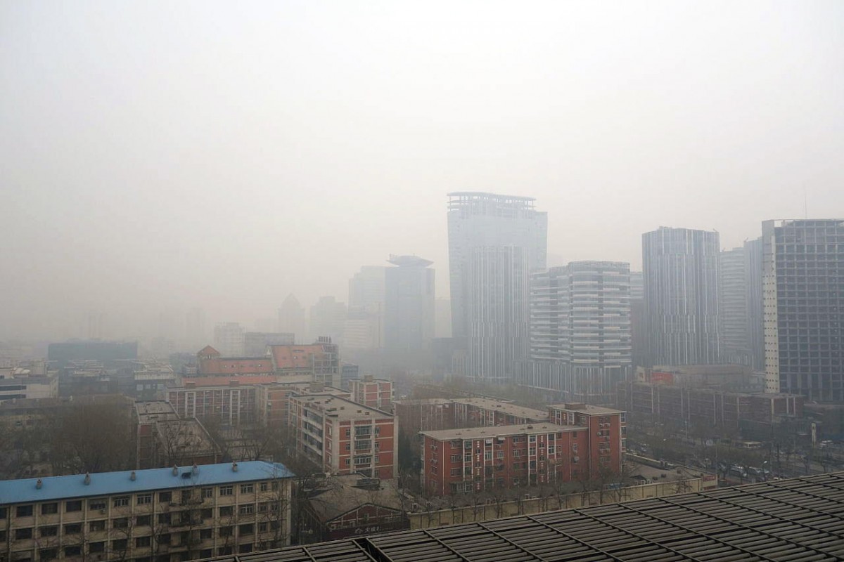 Air pollution hangs over a portion of Beijing, China, obscuring buildings. A new study finds that cities could cut greenhouse gas emissions by a third, significantly improving air quality and health, by adopting a series of strategies to reuse industrial waste. (Photo Courtesy: Humphrey School of Public Affairs, University of Minnesota)