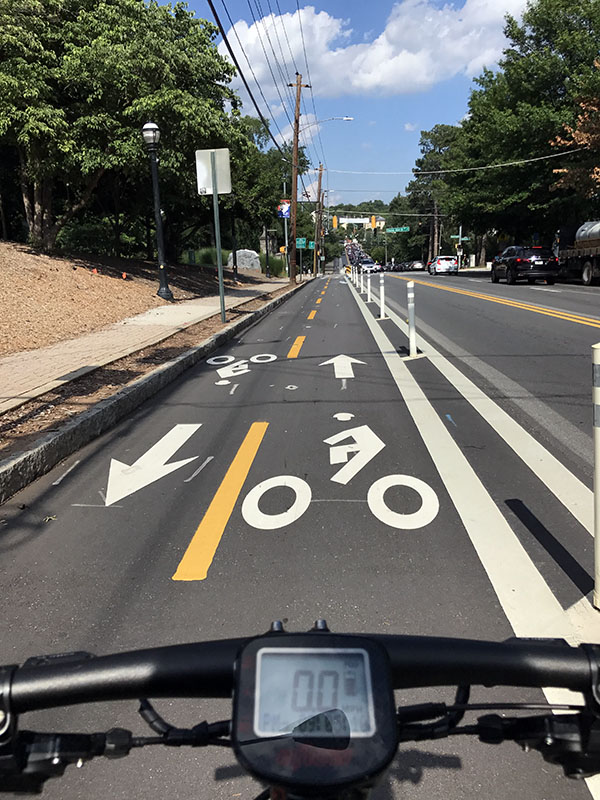 The cycle track along 10th Street in Midtown Atlanta near Piedmont Park provides a physical barrier between two-way bicycle traffic and vehicles. (Photo: Jess Hunt-Ralston)