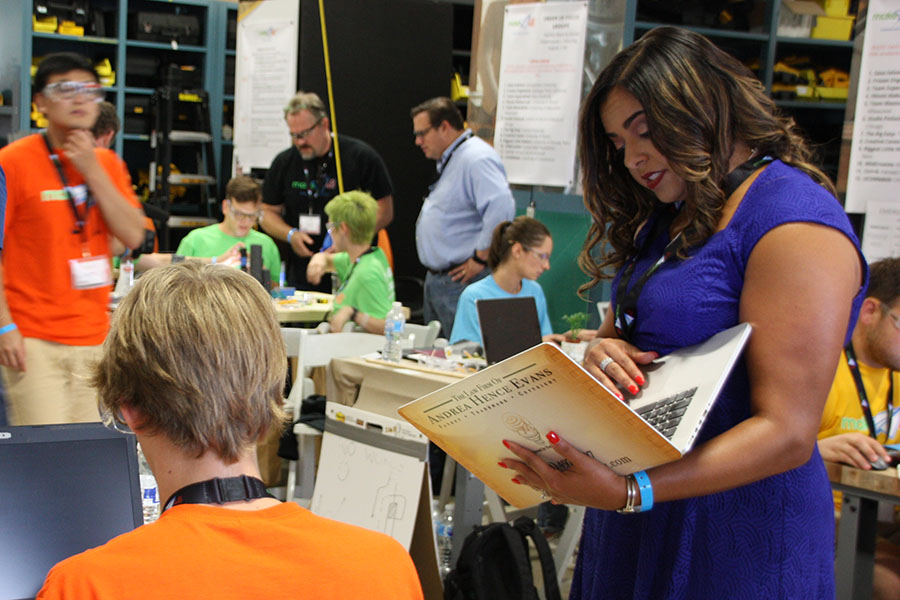 Andrea Hence Evans talks to a team of inventors about their idea during the taping of the PBS reality competition Make48 in 2018. Evans helped competitors assess whether the idea they were developing during the 48-hour contest could be patented. Though she studied civil engineering at Georgia Tech, Evans has started her own intellectual property law firm, written an Amazon bestseller, and appeared as an expert on the second season of the PBS show. (Photo Courtesy: Andrea Hence Evans)