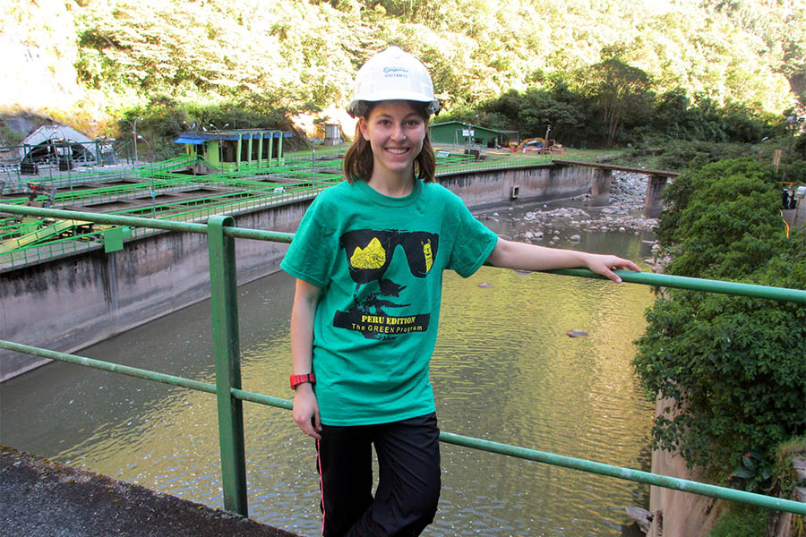 Civil engineering senior Maya Goldman stands in front of a hydroelectric dam and accompanying facility in Peru. Goldman traveled to Cuzco, Peru, and the surrounding areas in summer 2016 with the GREEN Program to learn how Peru blends ancient and modern techniques to provide clean water in a sustainable way. (Photo Courtesy: Maya Goldman)