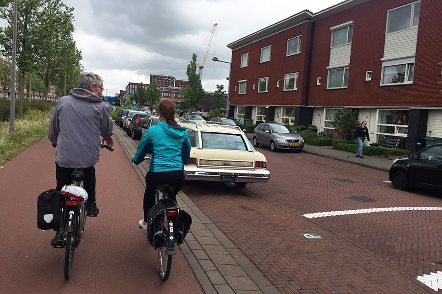 Regional planner and engineer Jan Termorshuizen, left, rides with School of Civil and Environmental Engineering master's student Annie Blissit along a cycle track in the Netherlands in May 2017. Termorshuizen was one of the local officials who helped teach students in Kari Watkins' Sustainable Transportation Abroad class about the Dutch transportation system. (Photo: Anna Nord)