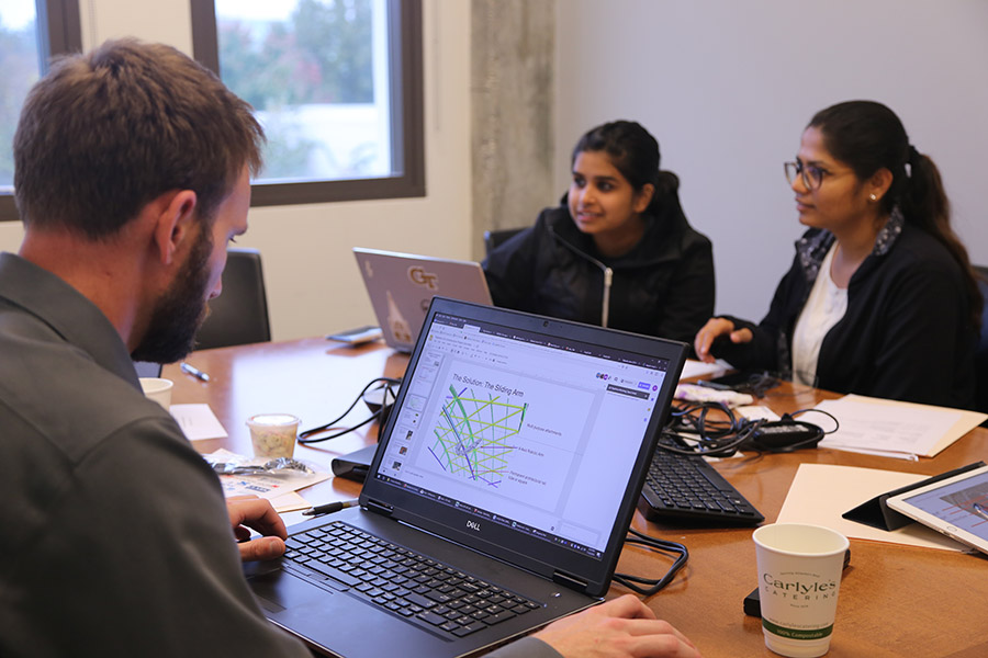 Rajshree Bhardwaj, right, and Sakshi Hattargi work with their team at the fall 2018 Tech Blitz at the School of Civil and Environmental Engineering. Teams of students and industry mentors had about six hours to come up with ideas for using robotics to improve the construction productivity, safety and quality of a project installing massive canopies at the landside terminal of Hartsfield-Jackson Atlanta International Airport. (Photo: Joshua Stewart)