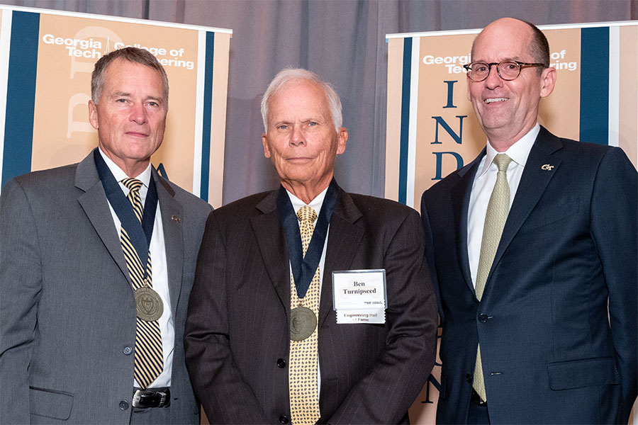 From left, ceremony co-host retired Adm. James A. “Sandy” Winnefeld, Ben Turnipseed, and engineering Dean Steve McLaughlin. (Photo: Gary Meek)