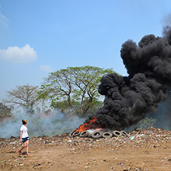 Woman watching a controlled burn