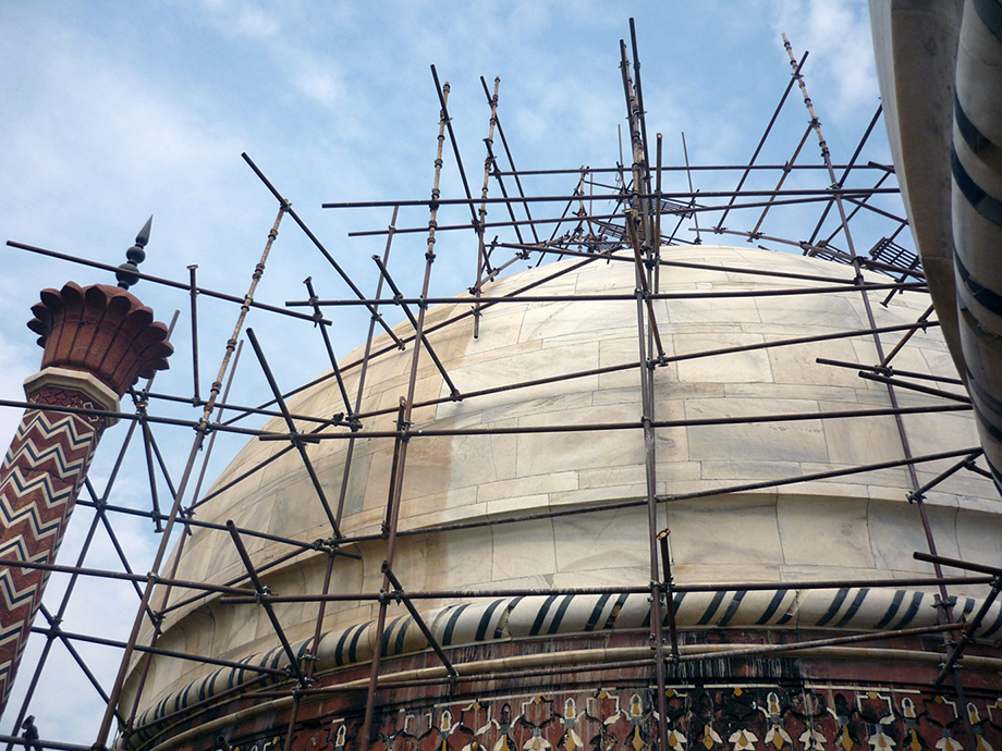 Scaffolding surrounds a portion of the Taj Mahal undergoing cleaning to remove brownish discoloration from the white marble. (Photo: Michael Bergin)
