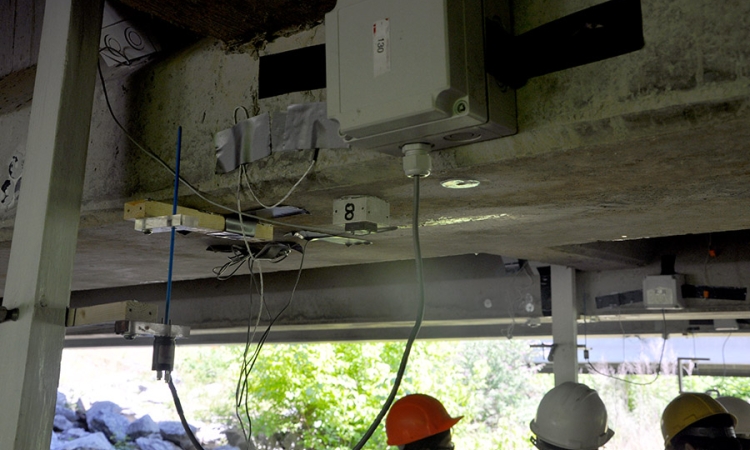 Yang Wang and students in his research group install sensors on a bridge in Bartow County, Georgia, in July 2016. Wang, Francesco Fedele and Rafi Muhanna in the School of Civil and Environmental Engineering will use data from instruments like these to feed a new interval-based optimization approach to assess structural systems and detect damage. (Photo Courtesy: Yang Wang)