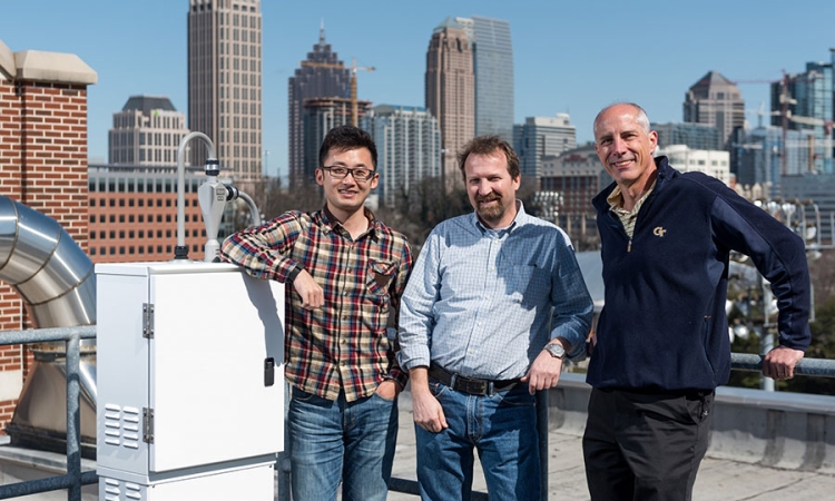Hongyu Guo, Rodney Weber and Ted Russell on their research platform atop the Ford Environmental Science & Technology Building.