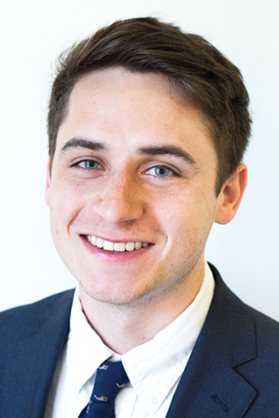 Headshot of a man in a suit