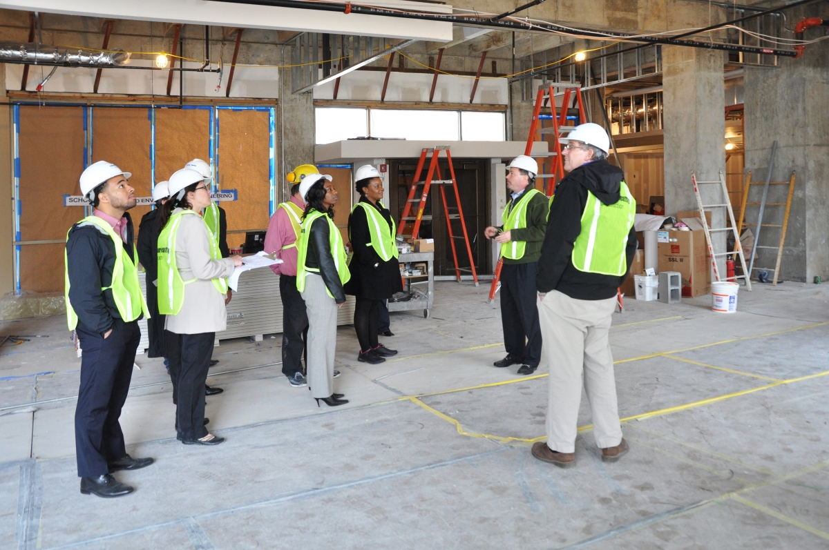 people in protective equipment on a construciton site