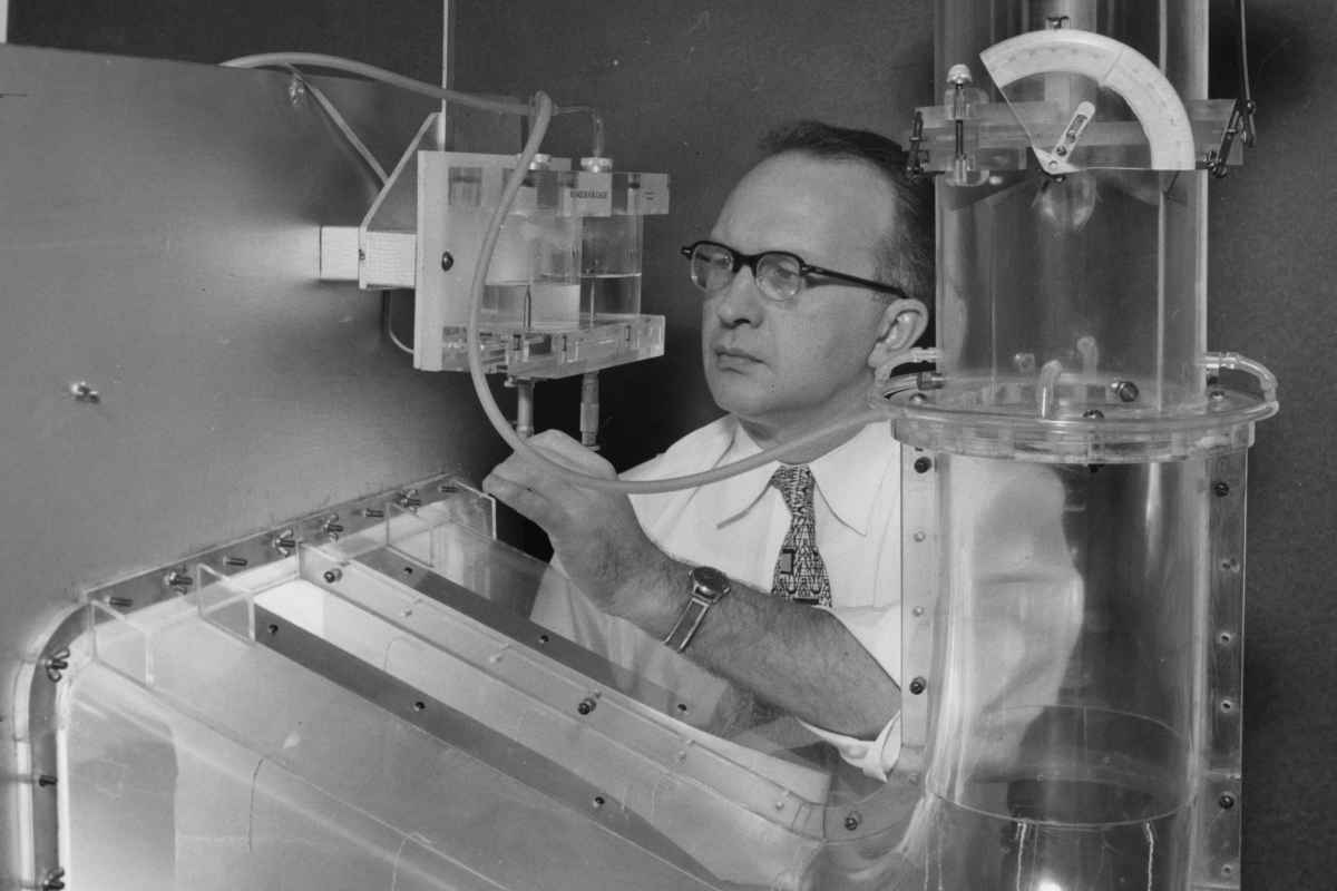 A man inspecting lab equipment 