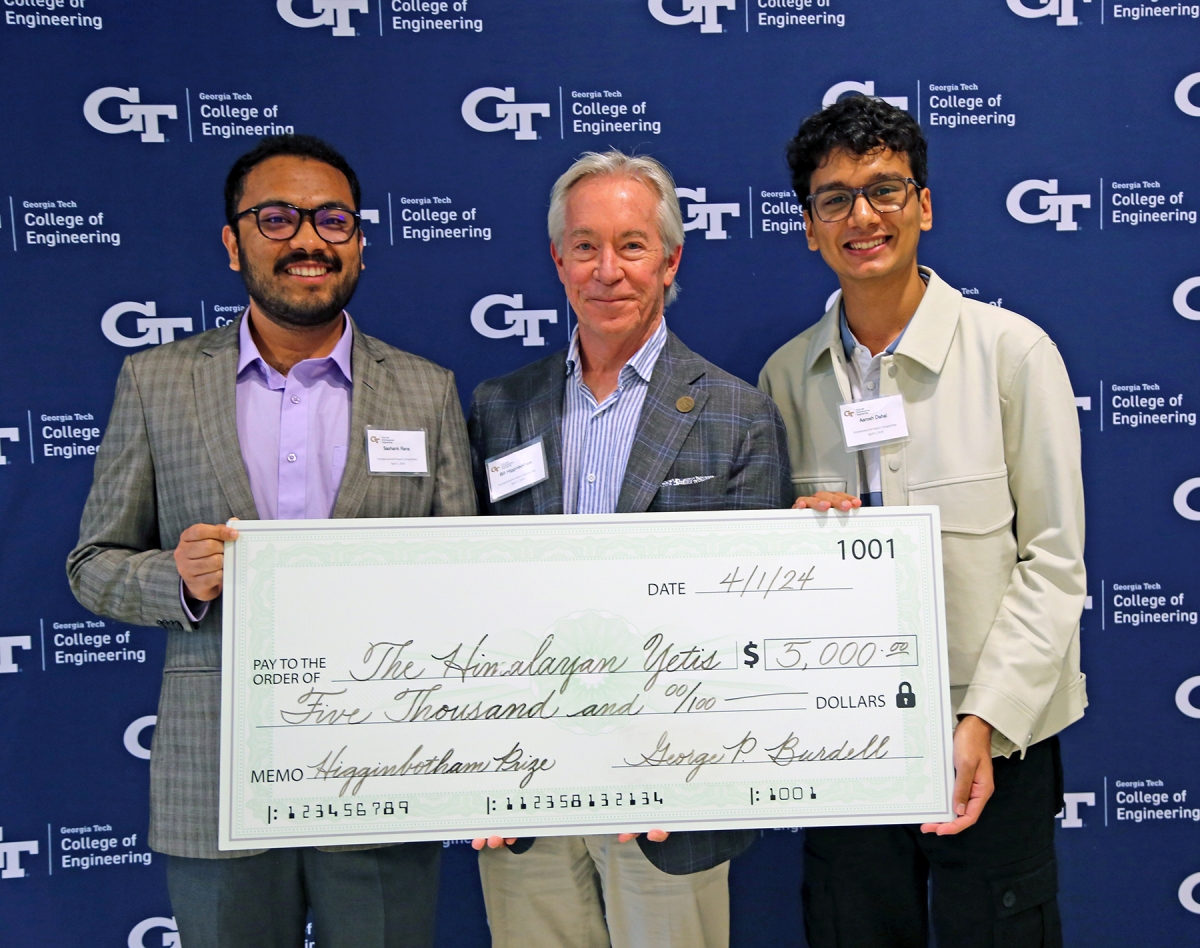 Winning team Himalayan Yetis pose with donor Bill Higginbotham and a big check