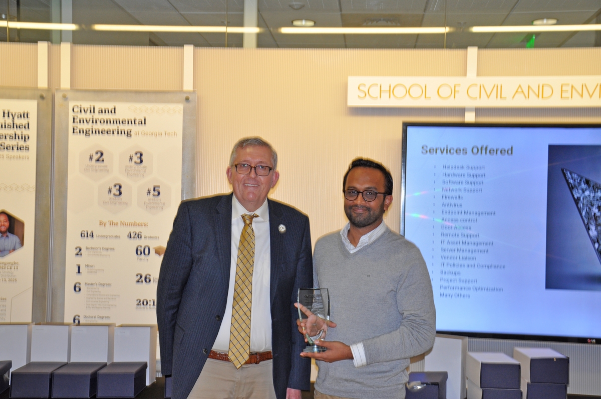 Portrait of Chair Don Webster with Aditya Kumar holding his award