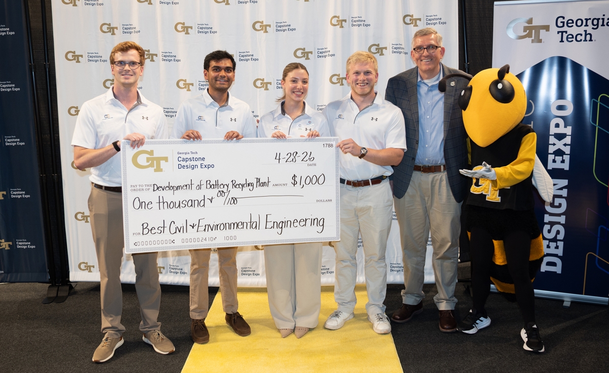 CivCore Consulting team holding their big check with school chair Don Webster and Buzz at the Capstone Design Expo
