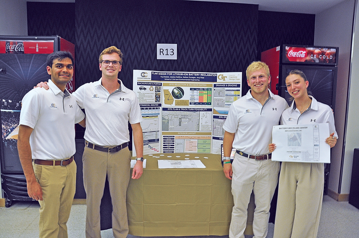 CivCore Consulting standing in front of their project at the Capstone Design Expo.