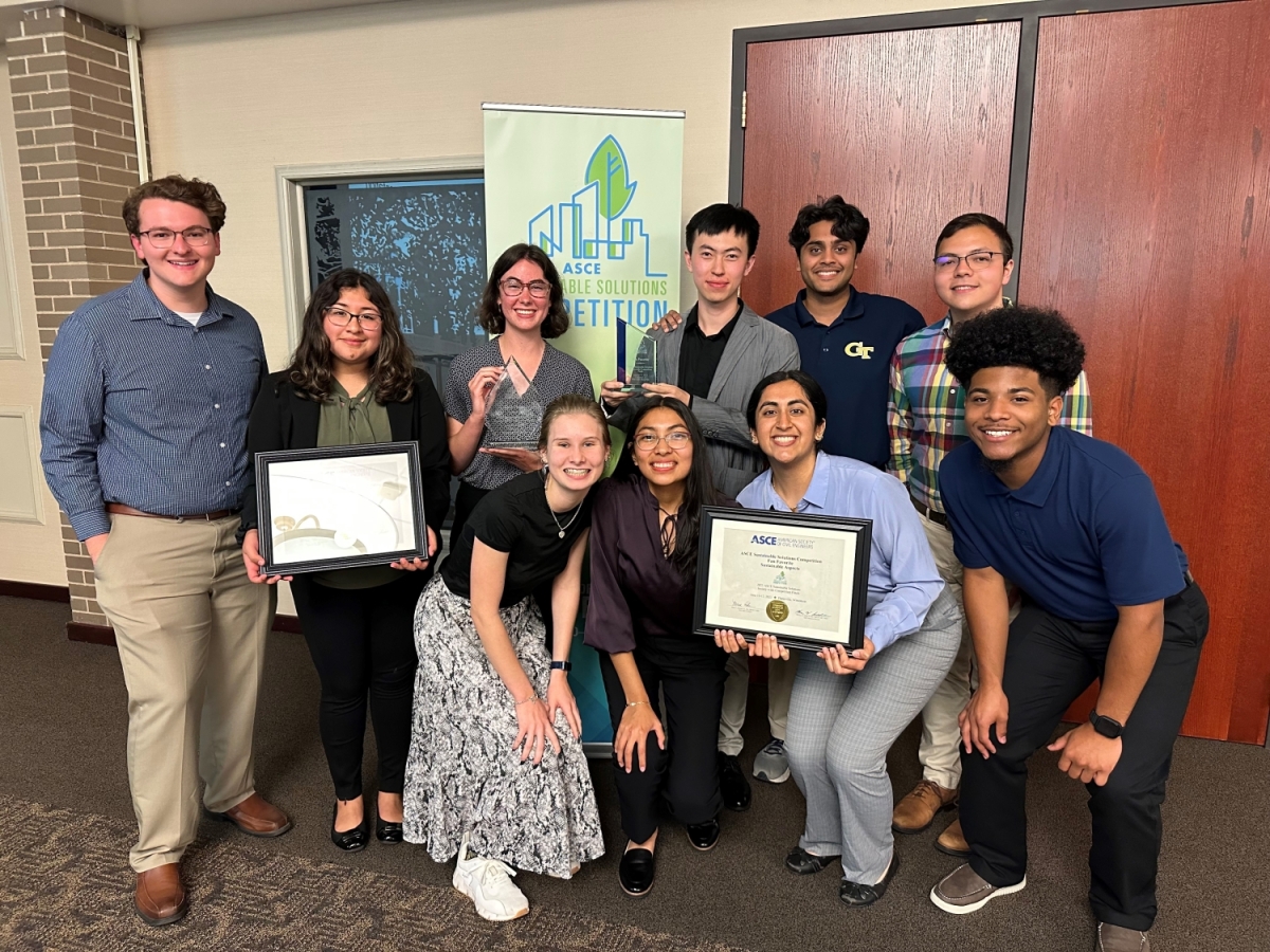 The Georgia Tech ASCE Sustainable Solutions team pose with their trophy after winning first place.