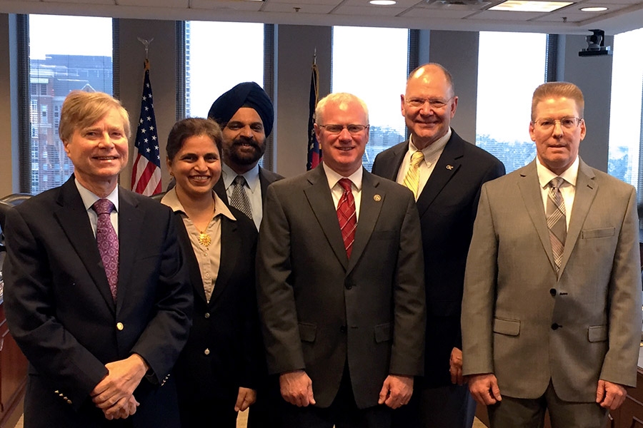 A group of Georgia Tech and Georgia Department of Transportation researchers after they received an AASHTO Sweet Sixteen award from DOT Commissioner Russell McMurry Dec. 8. Their work on corrosion-resistant concrete piles for marine environments has been used on bridges in Georgia and is being tested for use in nearby states.