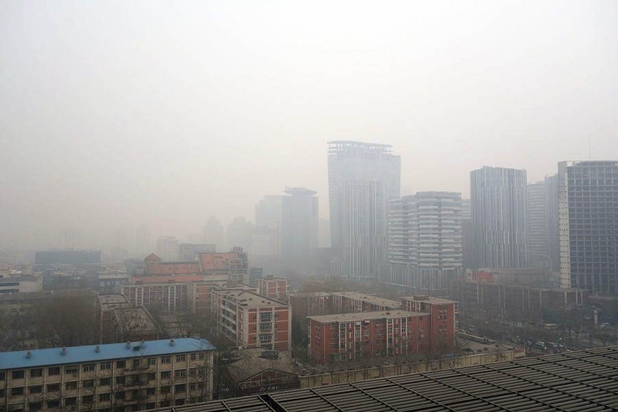 Air pollution hangs over a portion of Beijing, China. A new study by researchers from Georgia Tech, the University of Minnesota, Yale University and partners in China finds that cities could cut greenhouse gas emissions by a third, significantly improving air quality and health, by adopting a series of strategies to reuse industrial waste. (Photo Courtesy: Humphrey School of Public Affairs, University of Minnesota)