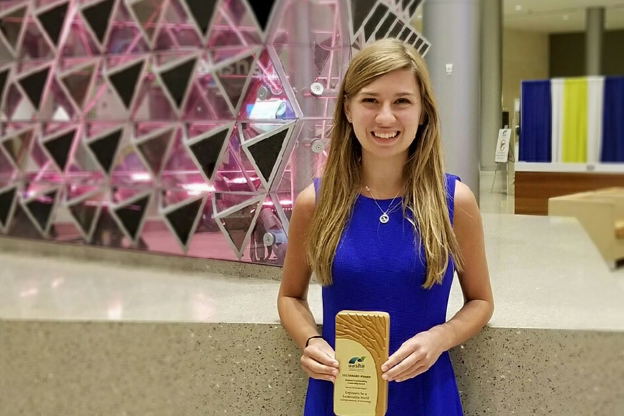 Grace Brosofsky, BSEnvE 2017, stands with her Student Sustainability Leadership award from the Association for the Advancement of Sustainability in Higher Education. (Photo Courtesy: Grace Brosofsky)
