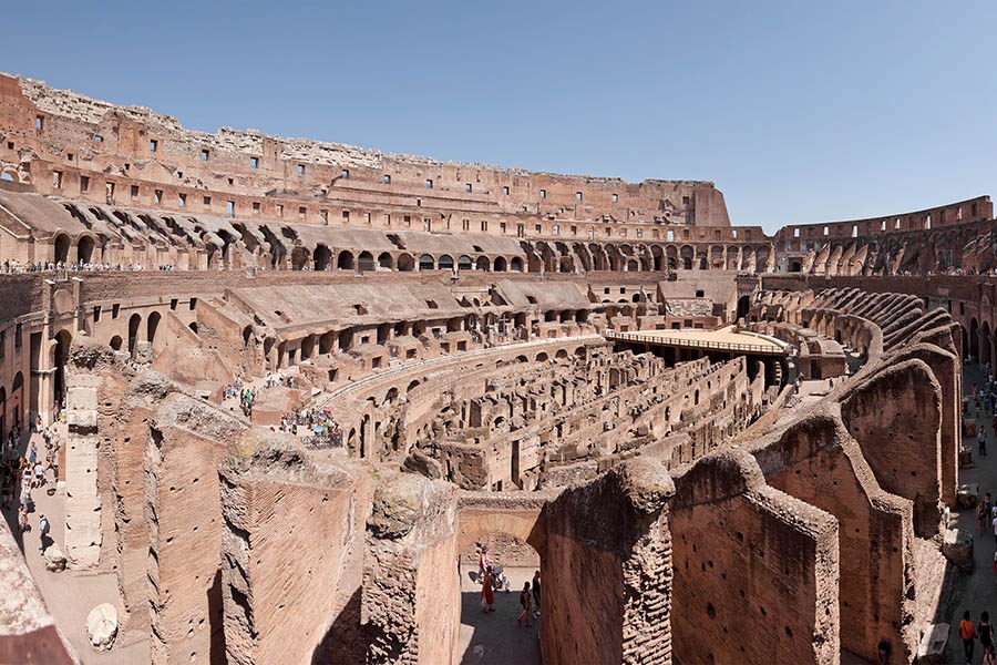 Roman arenas have survived in many earthquake-prone regions. Did the Romans inadvertently build seismic wave cloaks when they designed colosseums? Some researchers believe they did due to the arenas' resemblance to modern experimental elastodynamic cloaking devices. (Photo: Paolo Costa Baldi via Wikimedia Commons)