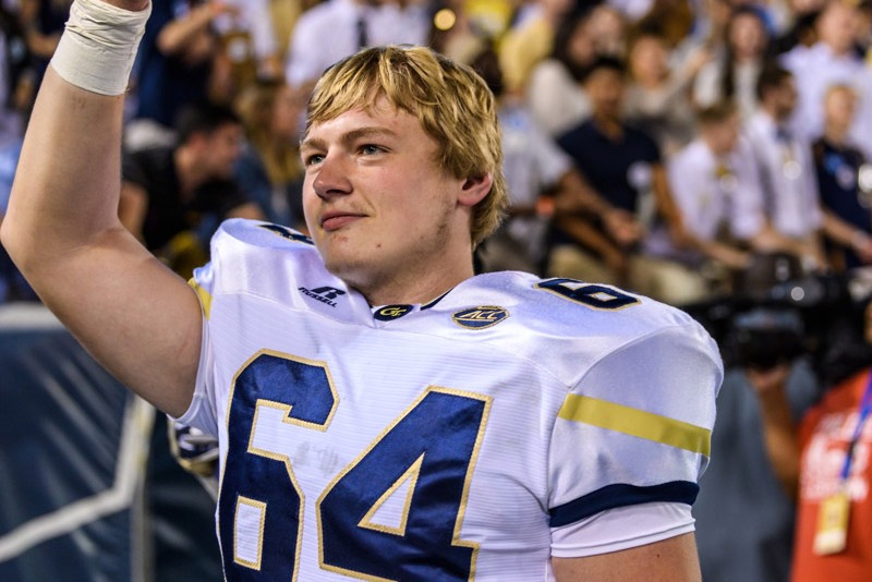 Civil engineering master's student Cheyenne Hunt waves during one of Georgia Tech's football games this year. Hunt is a walk-on offensive tackle finishing his final year on the team. (Photo: Danny Karnik/Georgia Tech Athletics)