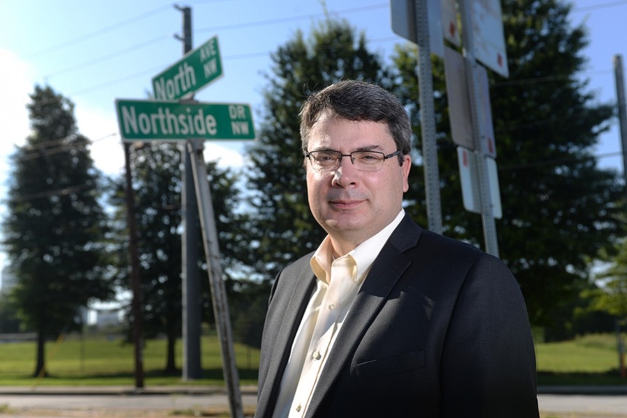 Associate Professor Michael Hunter stands along North Avenue, the City of Atlanta's new "smart corridor." Along with the city, the Georgia Department of Transportation and other partners, Hunter will help cut the ribbon for the corridor Sept. 14. (Photo: Chris Moore)