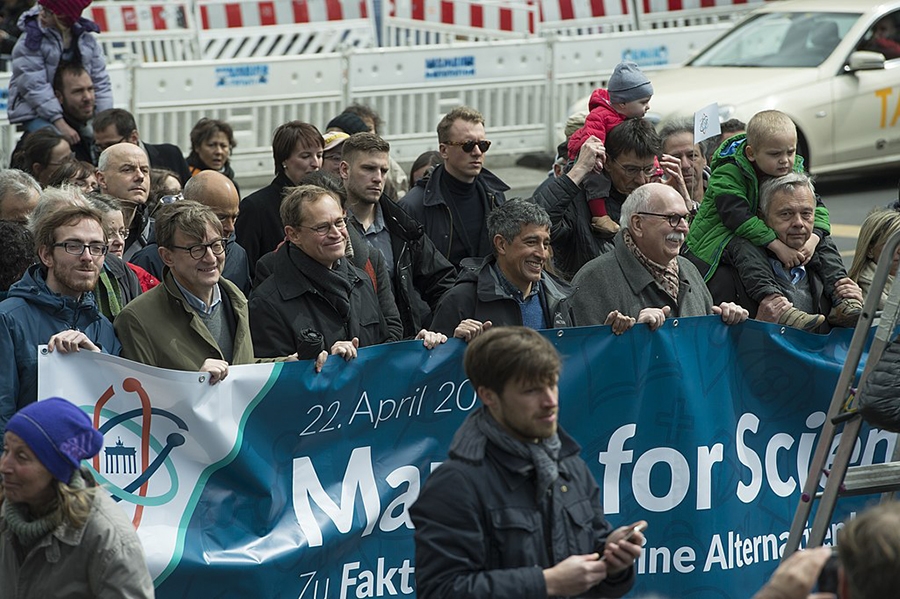 Demonstrators hold a banner reading "March for Science"