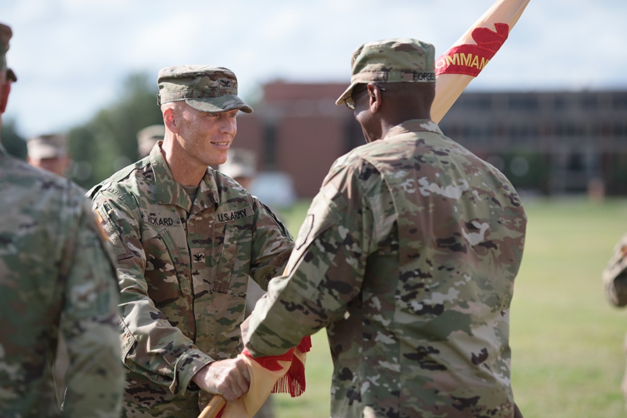 Col. Tom Rickard, BSCE 1990, assumed command of the U.S. Army’s Fort George G. Meade August 4. During the change of command ceremony, Rickard passes the garrison colors to Command Sergeant Major Rodwell L. Forbes.