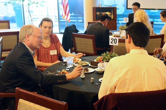 Art Williams talks with students at the School of Civil and Environmental Engineering's first scholarship and fellowship lunch. Williams and his family created the F. Everett Williams Scholarship for civil engineering students. (Photo: Joshua Stewart)