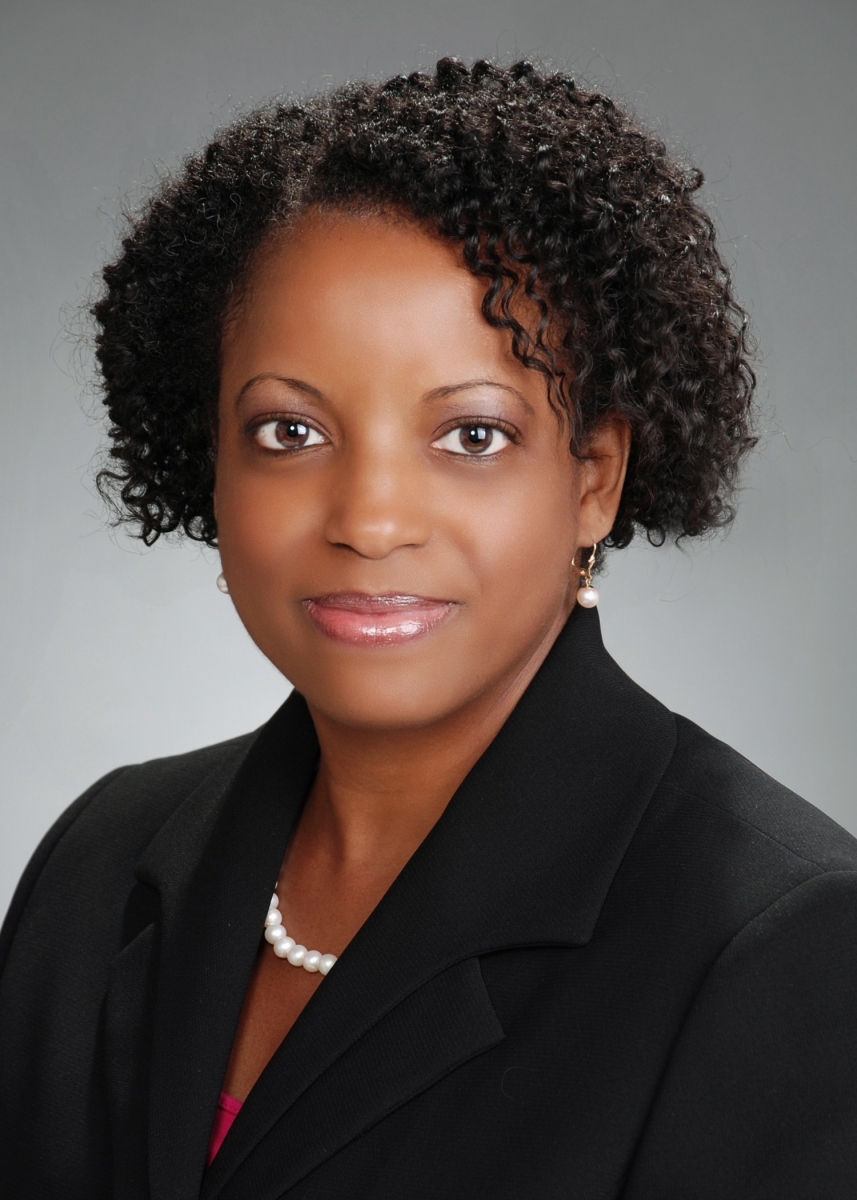 Portrait of Daveitta Knight in a black blazer and pink blouse