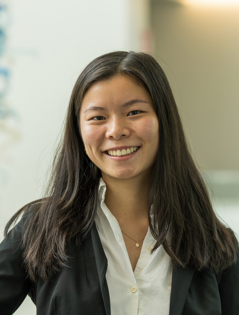 Portrait of Amanda Chin wearing a black blazer and a white blouse