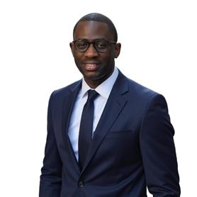 Sean Wright in a blue suit, white shirt and blue tie