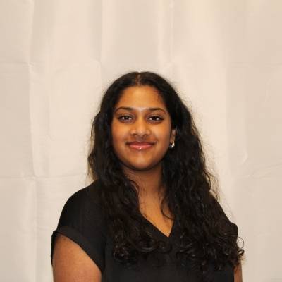 Portrait of Shreya Jayaram in a black blouse